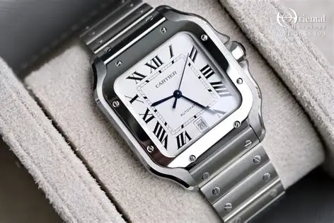 Cartier Santos watch with a silver bracelet and white dial